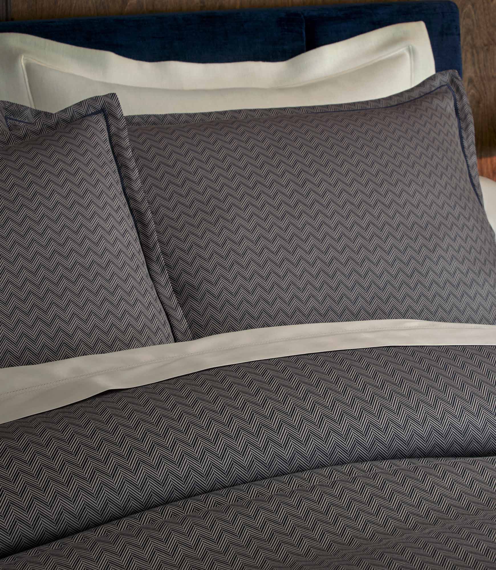 Savoy Jacquard Duvet Set in Navy styled with neutral color sheets
